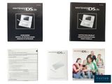 three nintendo ds manuals and a manual book on a white background