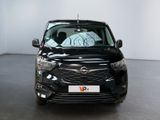 a picture of a black car parked in a showroom