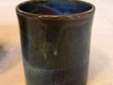 a cup that is sitting on a table in a room