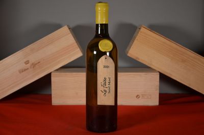 a bottle of wine that is sitting on a table