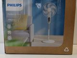 packaging of a box with a fan inside of it on a table