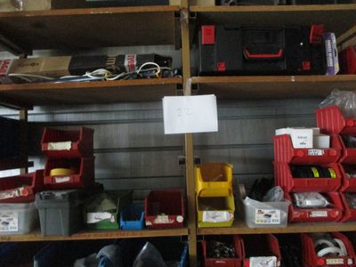 many different types of tools on the shelves in the garage