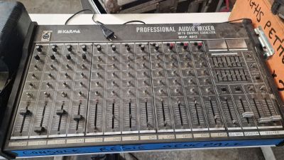 a large mixer sitting on a table with headphones on it