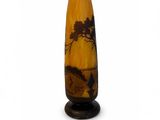 a vase that has a picture of a tree on it