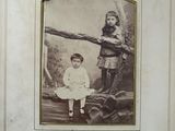 an old photo of a boy and a girl standing next to each other