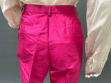 an image of a woman in pink pants and a white shirt