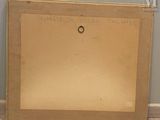 an old picture of a picture frame sitting on top of a wooden floor