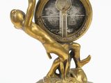 bronze figurine of a man holding a clock on a pedestal