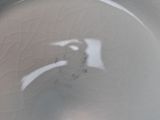 a close up of a white toilet bowl with the lid down