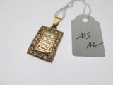 a close up of a necklace with a tag attached to it