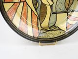 a plate with a picture of a man and a woman on it
