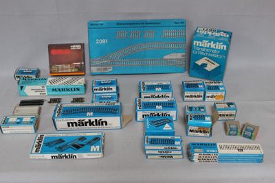 many boxes of cigarettes sitting on a white surface