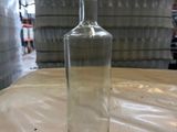 a bottle of water sitting on a table in a warehouse