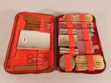 a red case filled with tools and a toothbrush