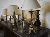 a lot of lamps on a table in a room