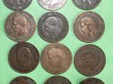 six different types of coins on a green surface