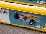 two yellow boxes with legos on them sitting on the floor