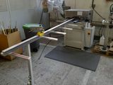 an image of a room that has a table and a chair in it
