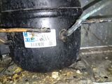 a black pot with a sticker on it sitting on a stove