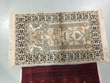 two oriental rugs on a table with a white background