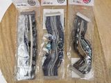three pairs of scissors in the packaging on the table