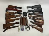 many different types of guns and knives laid out on the table