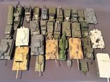 many different types of military vehicles on a table