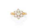 an 18k gold and diamond flower ring