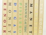 five books that are stacked on top of each other