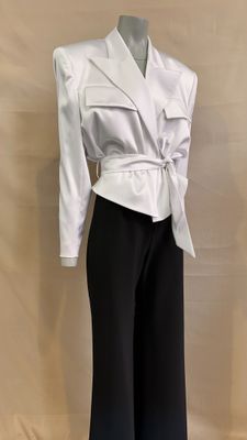a picture of a white shirt and black pants on a mannequin mannequin