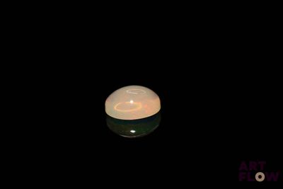 a candle that is lit up in the dark