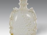 an image of a white vase with gold speckles on it