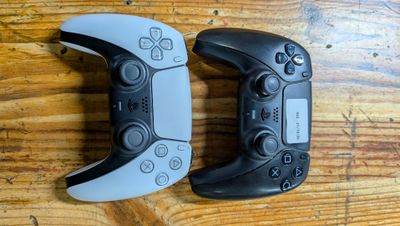 two video game controllers that are sitting on a table