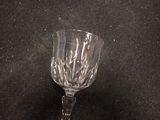 a wine glass that is sitting on a table