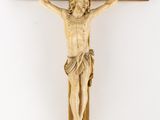 an old wooden crucif with a wooden cross on a white background