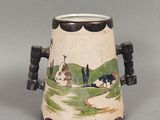 un petit vase orné d'une peinture représentant des vaches