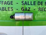a close up of a green and white van with a sign on the side