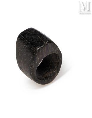 an image of a close up of a black ring on a white surface