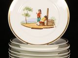 a stack of plates with a picture of a man and a woman on them