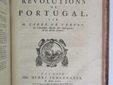 an open book with a picture of a man in a hat on top of it