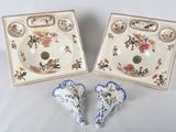 two pieces of porcelain on a white table