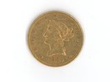 a gold coin with a woman ' s head on it