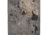 une vieille plaque en métal argenté représentant un homme et une femme