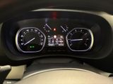 the dashboard of a car with a speedometer, gauges, and a steering wheel