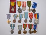 several medals and medals are displayed on a white surface