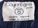 a close up of a label on the back of a sweater