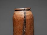 a close up of a vase on a gray surface