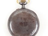 an old pocket watch with a gold ring on a white background