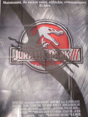 L'affiche du film « Jurassic Park » est accrochée au mur.