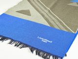 the scarf is blue and grey with black fringes on it